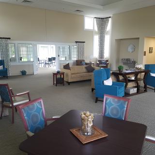 A spacious and modern living room with comfortable seating and abundant natural light.