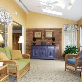 A cozy living room with comfortable seating, warm colors, and natural light.