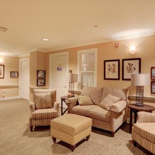 A cozy living room with comfortable seating and warm lighting.