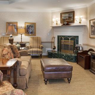 A cozy living room with elegant furniture and a fireplace.