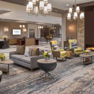 A modern hotel lobby with comfortable seating and elegant lighting.