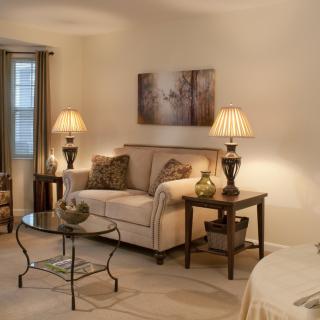 Cozy living room with elegant decor and warm lighting.