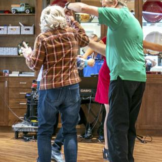 A group of people dancing together in a social setting.