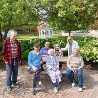 A sunny day at the park with friends enjoying each other's company.