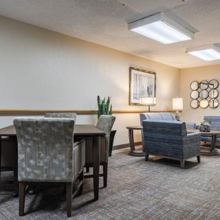 A cozy living room with comfortable seating and elegant decor.