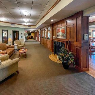 A cozy lobby with comfortable seating and warm lighting.