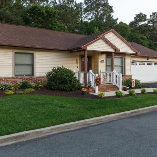 A suburban home with a well-maintained front yard and driveway.