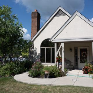 A charming residential house with a well-maintained garden and a welcoming entrance.