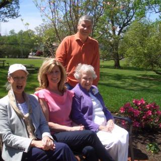 A group of people enjoying a sunny day in the garden.