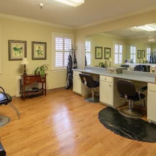 A bright and inviting hair salon with modern styling stations.