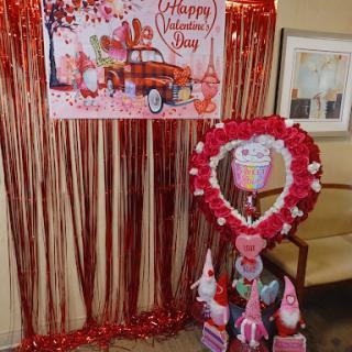 A festive display celebrating Valentine's Day with heart decorations and vibrant colors.
