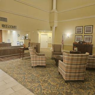 A cozy hotel lobby featuring comfortable seating and a welcoming reception area.