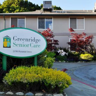 An exterior view of Greenridge Senior Care with well-maintained landscaping.