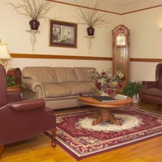A cozy living room features comfortable seating and elegant decor.