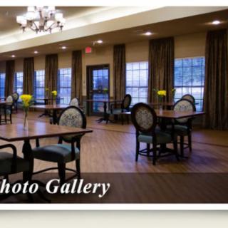Spacious and elegantly designed dining area with large windows and wooden flooring.