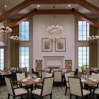 Elegant dining room with high ceilings and large windows, featuring stylish chandeliers and neatly arranged tables.