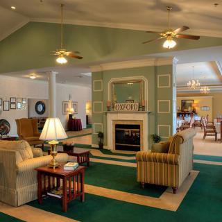 A cozy living room with a fireplace and comfortable seating arrangements.