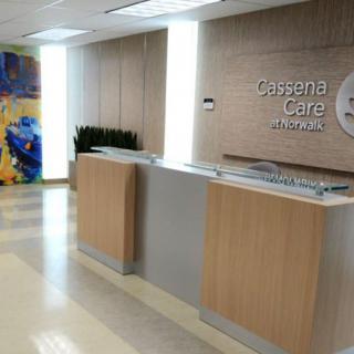 Modern reception area with a sleek desk and contemporary decor.