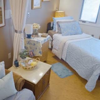 A cozy bedroom featuring soft bedding and warm decor.