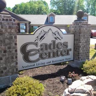 Signage for Cades Center, a destination for outdoor activities.