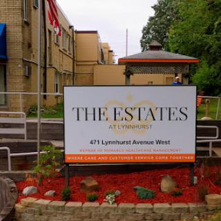 A sign indicating 'The Estates', an apartment complex located at 473 Lynnhaven Drive West.