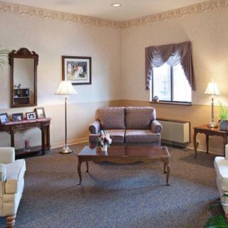 A cozy living room with classic furniture and warm lighting.