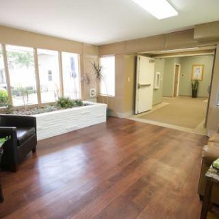 A bright and inviting lobby with modern furnishings and natural elements.