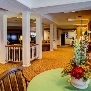 A spacious lounge area with comfortable seating and elegant decor.
