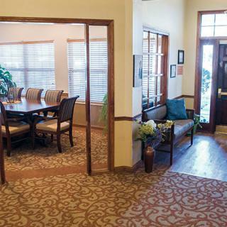 A welcoming office space featuring a meeting room and a lobby area with comfortable seating.