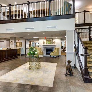 Spacious lobby area with elegant decor and seating.