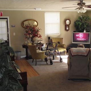 A cozy living room with traditional decor and a television.