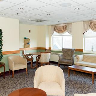 A cozy waiting room with comfortable seating and natural lighting.