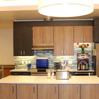 A modern kitchen featuring sleek cabinetry, contemporary appliances, and a stylish countertop.