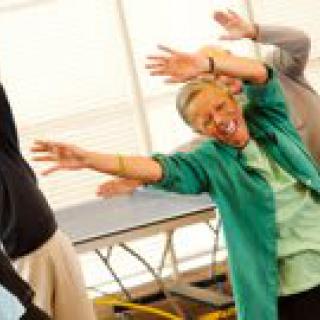 A group of seniors engaging in a lively exercise session.