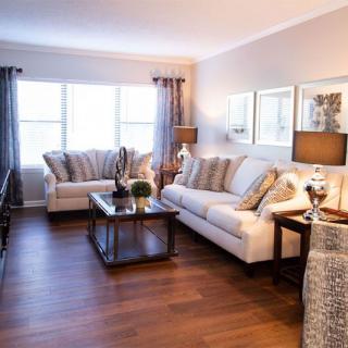 A stylish and bright living room with comfortable sofas and elegant decor.