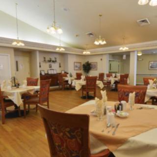 An elegant dining area with neatly arranged tables and comfortable seating.