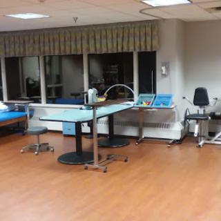 A view of a rehabilitation therapy room equipped with various treatment facilities.