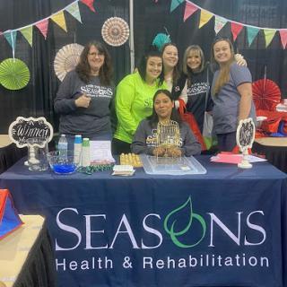 The team from Seasons Health & Rehabilitation showcasing their services at a local event.