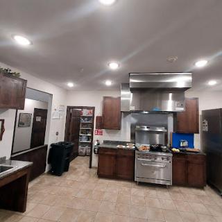A modern kitchen featuring sleek cabinets, stainless steel appliances, and a spacious layout.