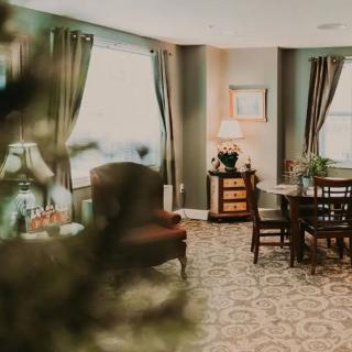 A cozy living room with elegant furniture and soft lighting.