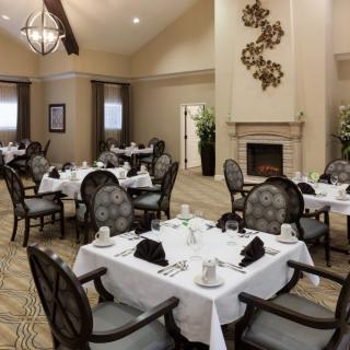 An elegant dining area with tastefully set tables and comfortable seating.