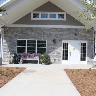 A modern house with a stone exterior and a welcoming entrance.