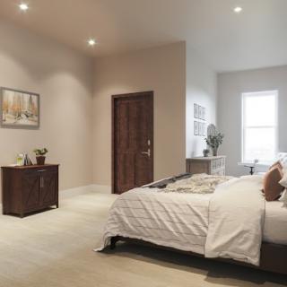 A modern and cozy bedroom with neutral tones.