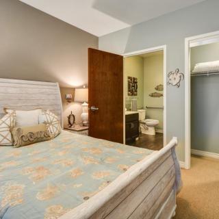 A cozy bedroom with an adjoining bathroom and closet.