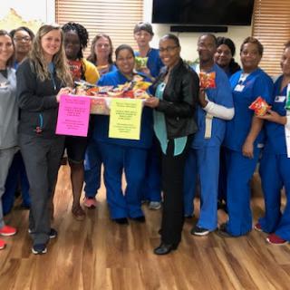 Healthcare team celebrating their efforts and contributions in a supportive environment.