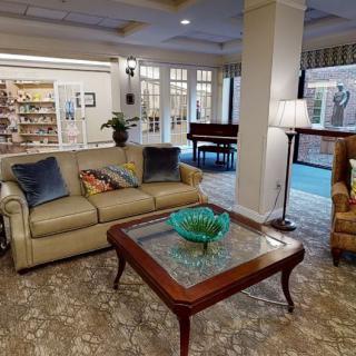 A cozy living room featuring a comfortable sofa, elegant coffee table, and inviting decor.
