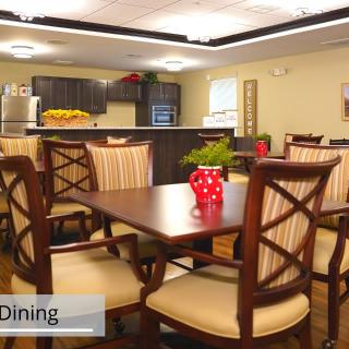 A modern dining area with wooden furniture and kitchen appliances.