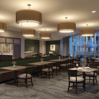 A modern restaurant interior with elegant lighting and arranged seating.