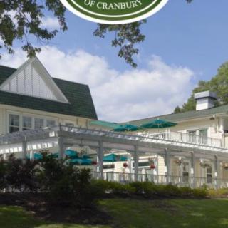 A scenic view of a restaurant with a green roof and outdoor seating area.