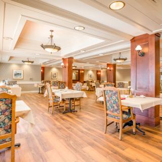 Spacious dining area with elegant decor and comfortable seating.